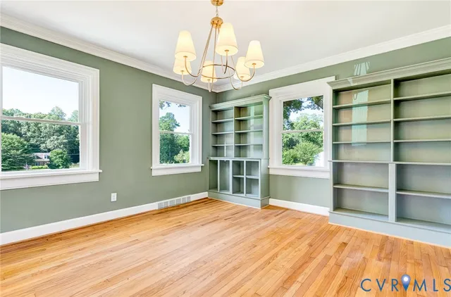 an aerial view of a house with garden space and street view