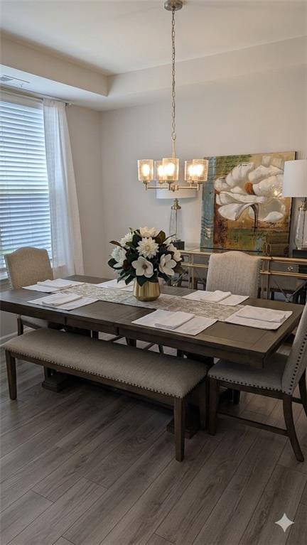 4830 Spangle Court Cumming, GA 30028 - Photo 7 of 18 a room with a table chairs and wooden floor