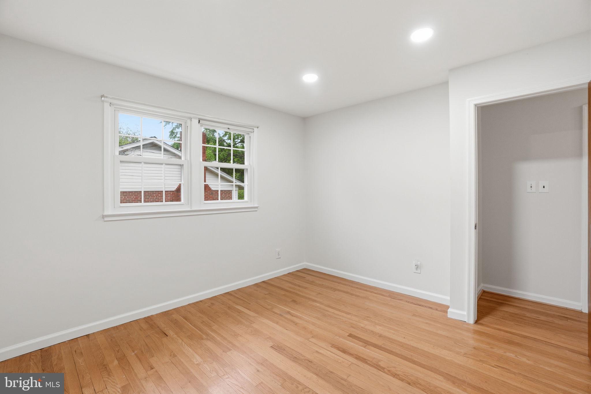 5304 Pillow Lane Springfield, VA 22151 - Photo 14 of 32 a view of empty room with wooden floor and fan