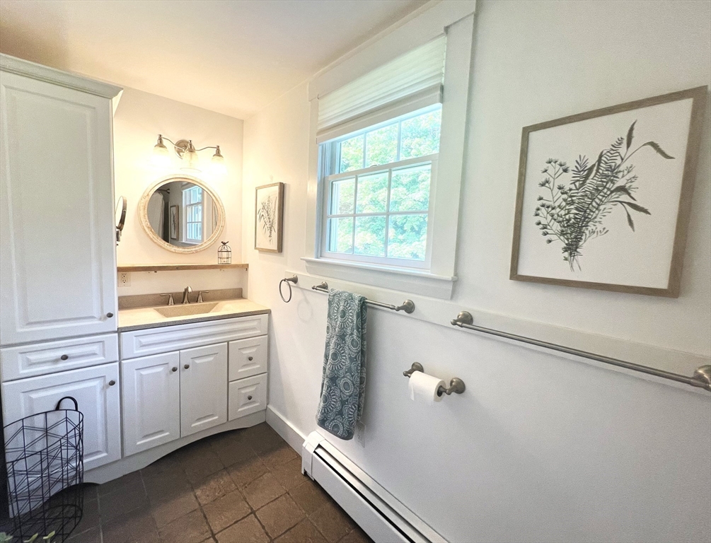9 Newton Junction Road Kingston, NH 03848 - Photo 25 of 40 a bathroom with a tub sink and mirror