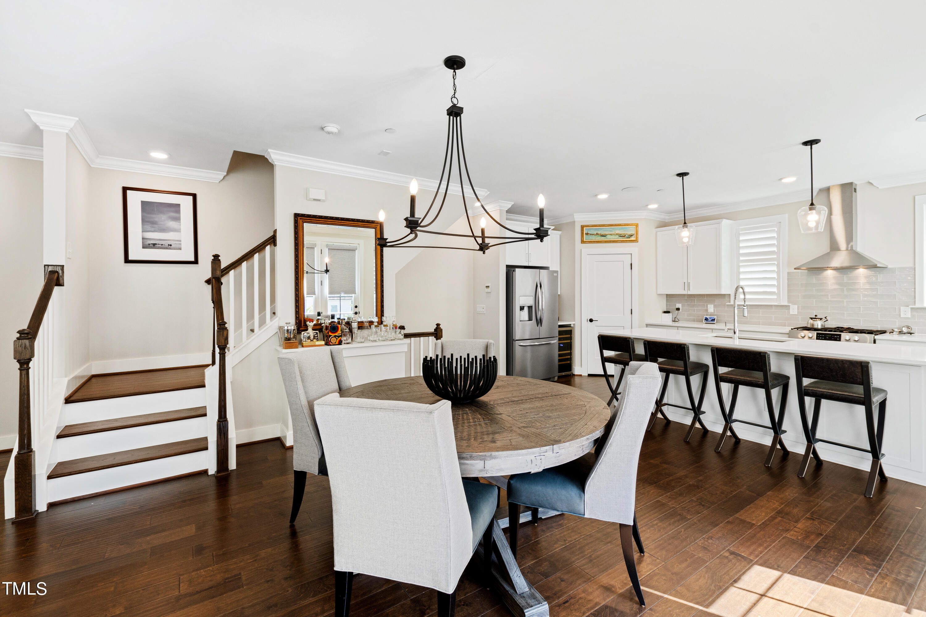 1610 Draper View Loop, Unit 106 Raleigh, NC 27608 - Photo 11 of 36 a view of a dining room with furniture window and wooden floor