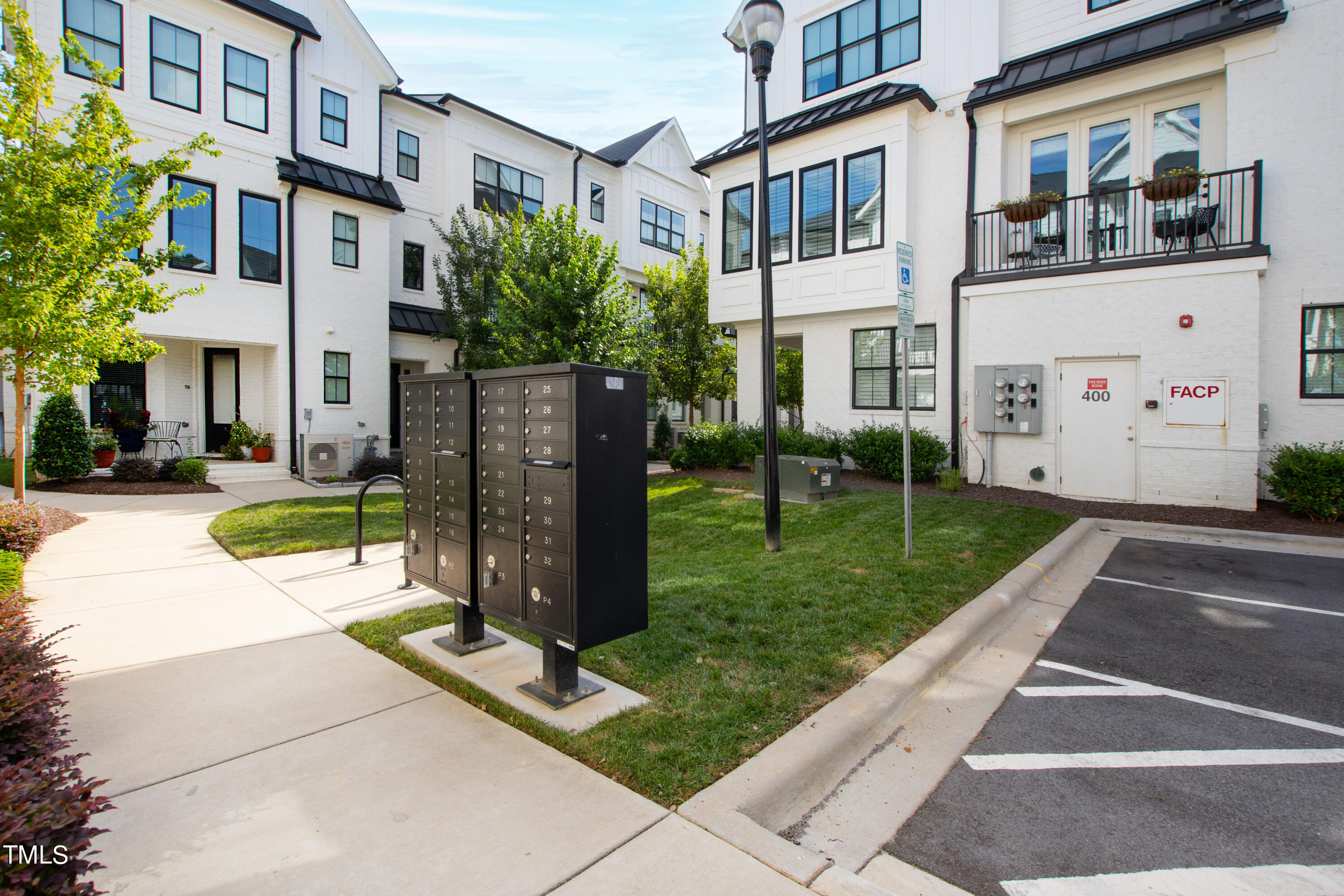 1610 Draper View Loop, Unit 106 Raleigh, NC 27608 - Photo 25 of 36 a view of a building with a yard