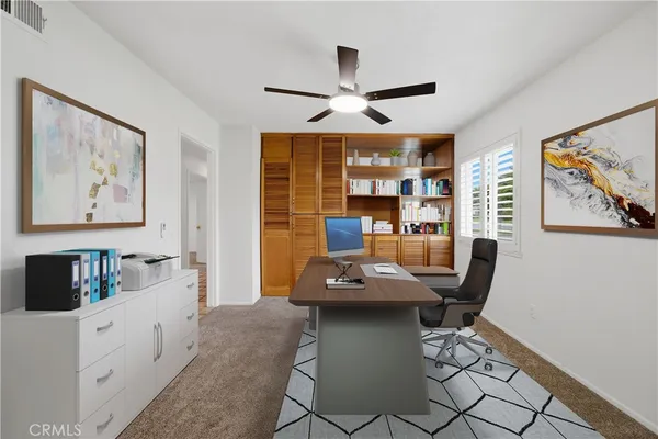 a workspace with furniture and window