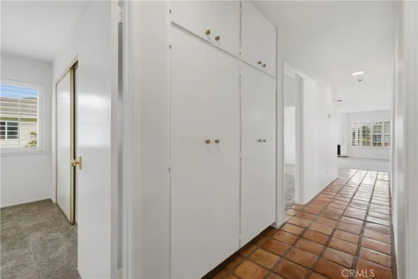 a view of a hallway with a chandelier