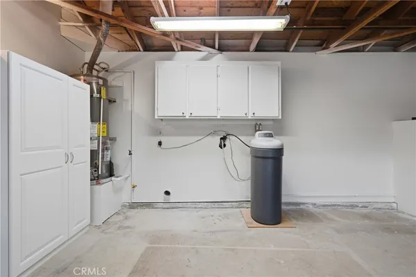 a view of a storage & utility room with a sink