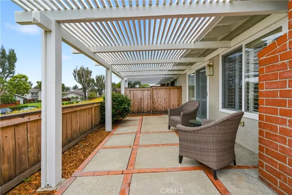 a patio with table and chairs