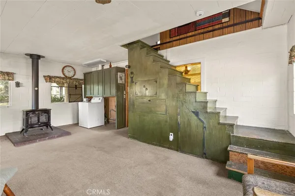 a view of a livingroom with furniture and a livingroom
