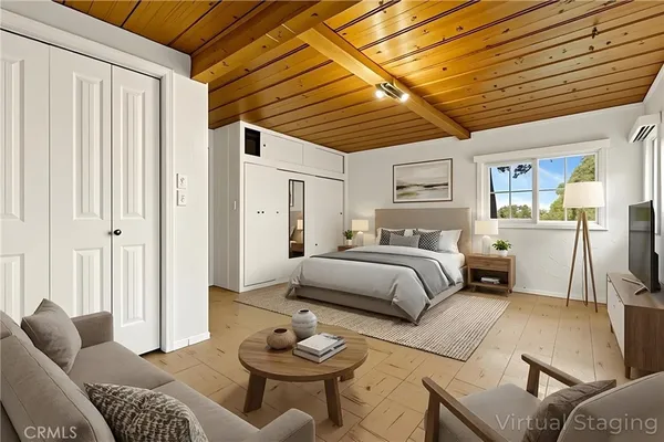 a view of a house with a yard and large tree