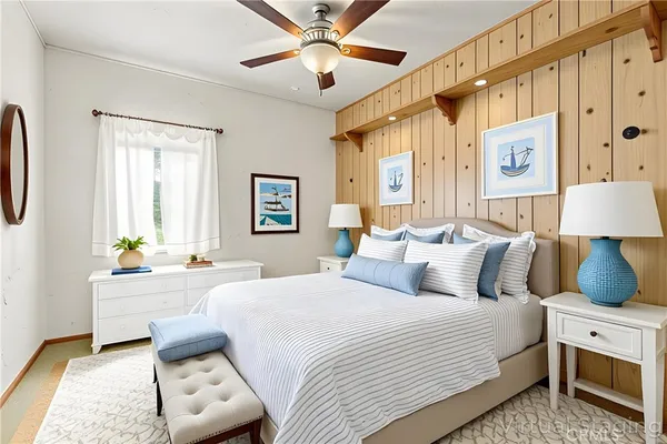 a bathroom with a toilet a sink and a mirror