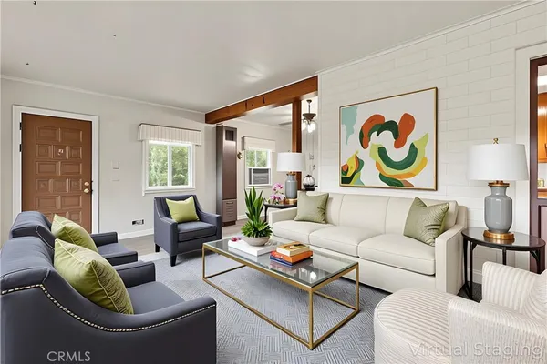 a living room with furniture and a floor to ceiling window
