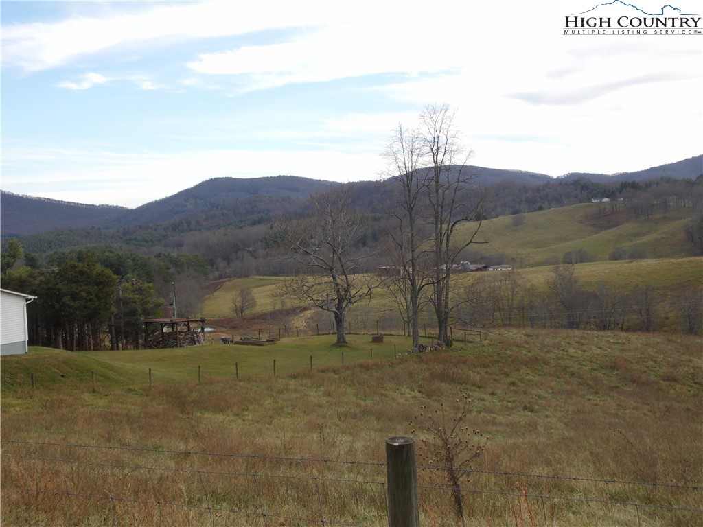 Tedder Road Sparta, NC 28675 - Photo 14 of 28 a view of a dry yard with mountain
