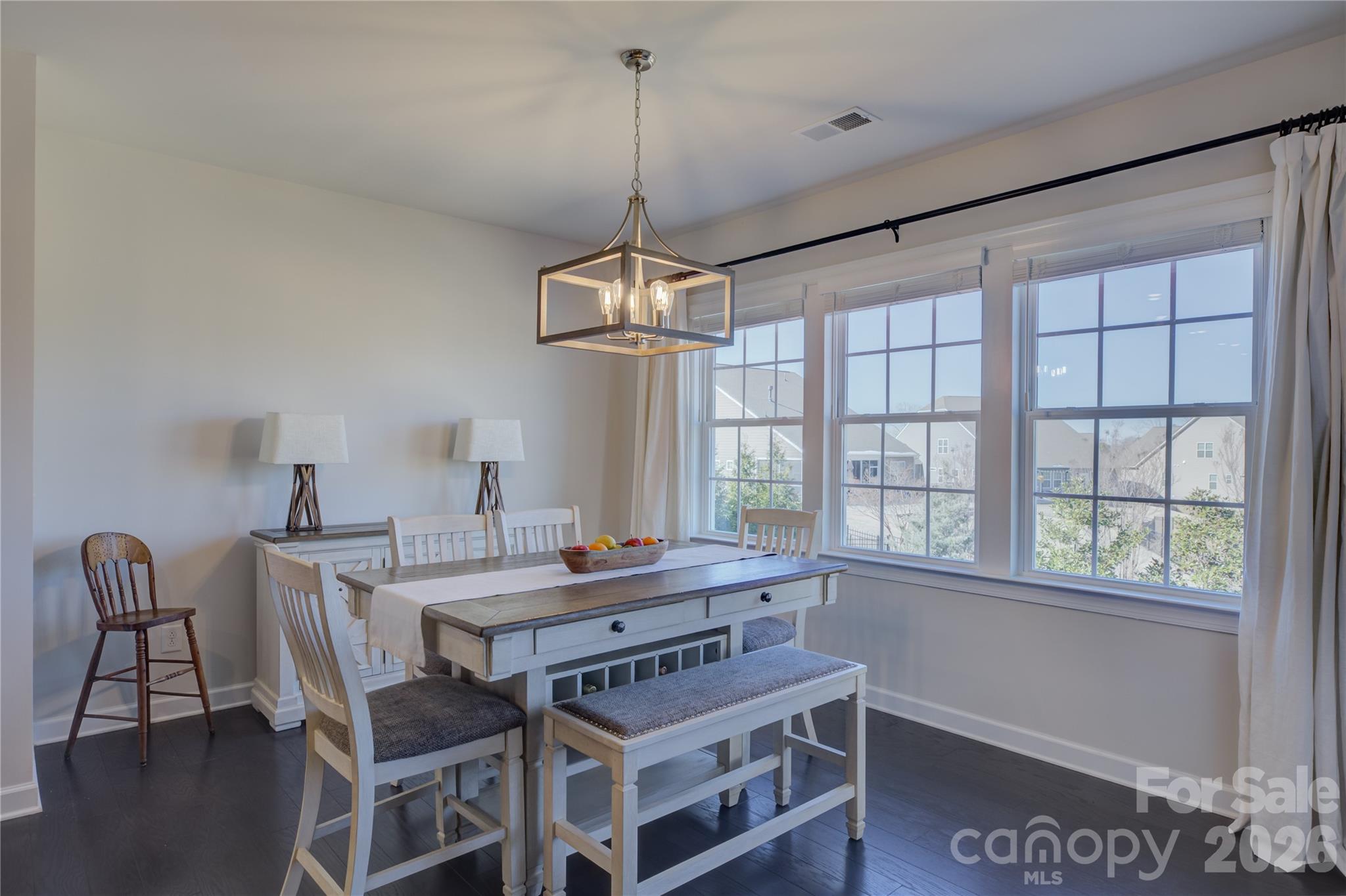 16541 Cozy Cove Road Charlotte, NC 28278 - Photo 13 of 47 a view of a dining room with furniture window and wooden floor