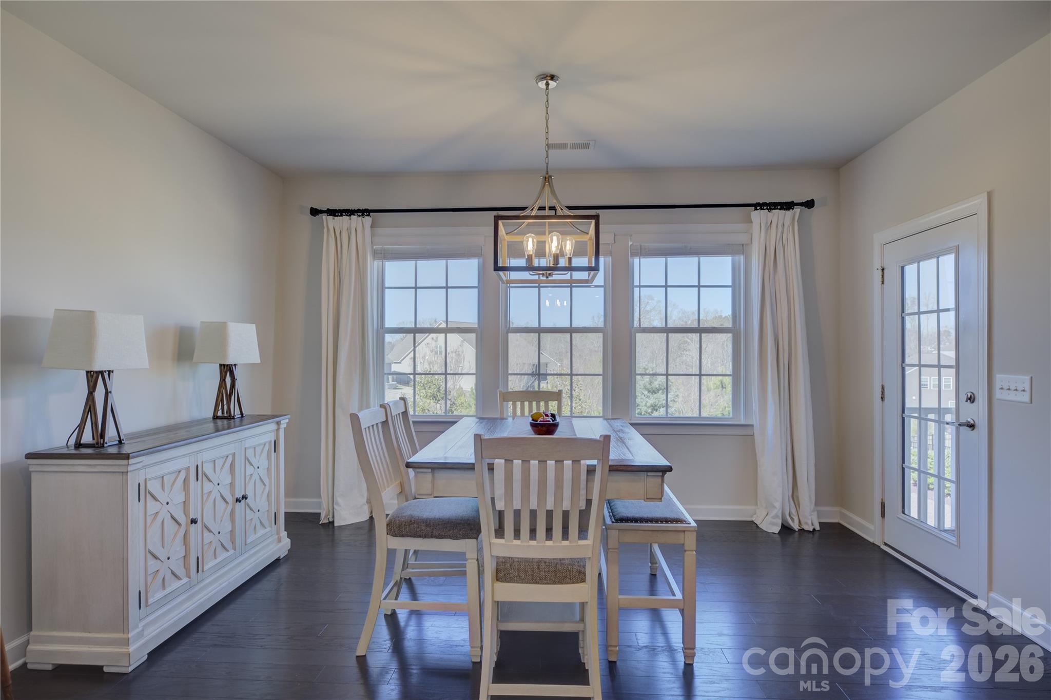 16541 Cozy Cove Road Charlotte, NC 28278 - Photo 14 of 47 a view of a dining room with furniture window and wooden floor