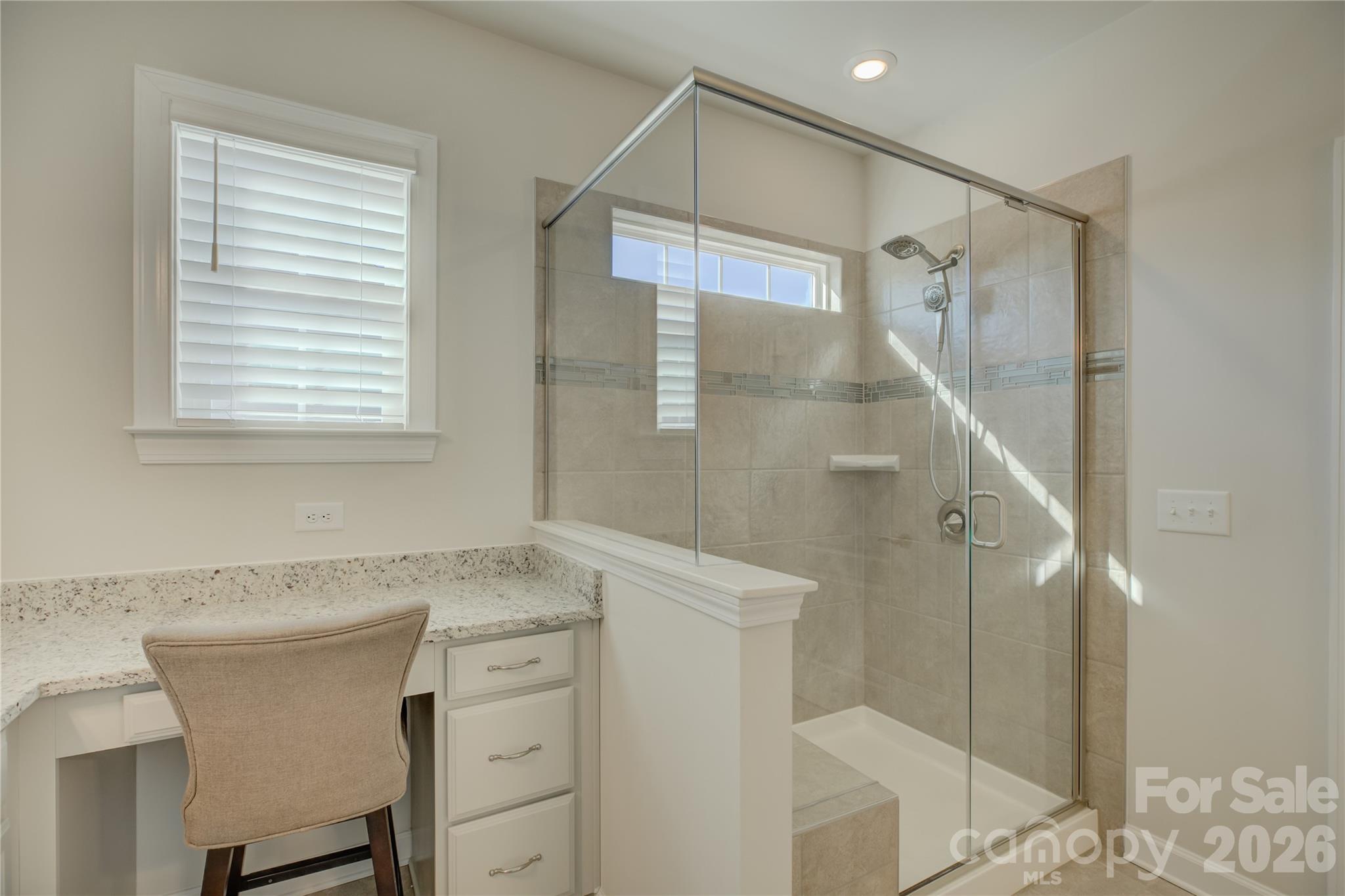 16541 Cozy Cove Road Charlotte, NC 28278 - Photo 24 of 47 a bathroom with a granite countertop sink a shower and a mirror