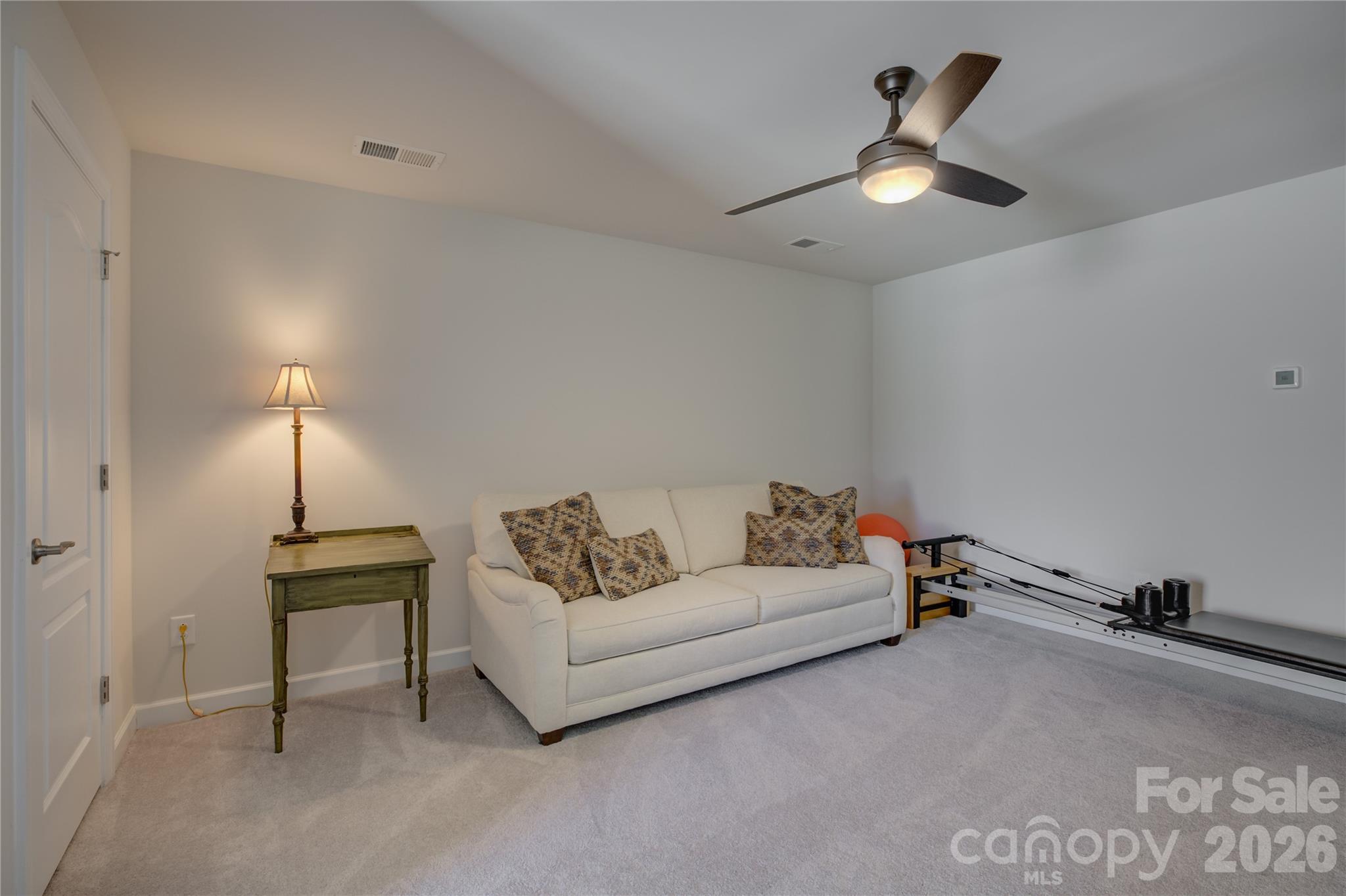 16541 Cozy Cove Road Charlotte, NC 28278 - Photo 33 of 47 a living room with furniture and chandelier