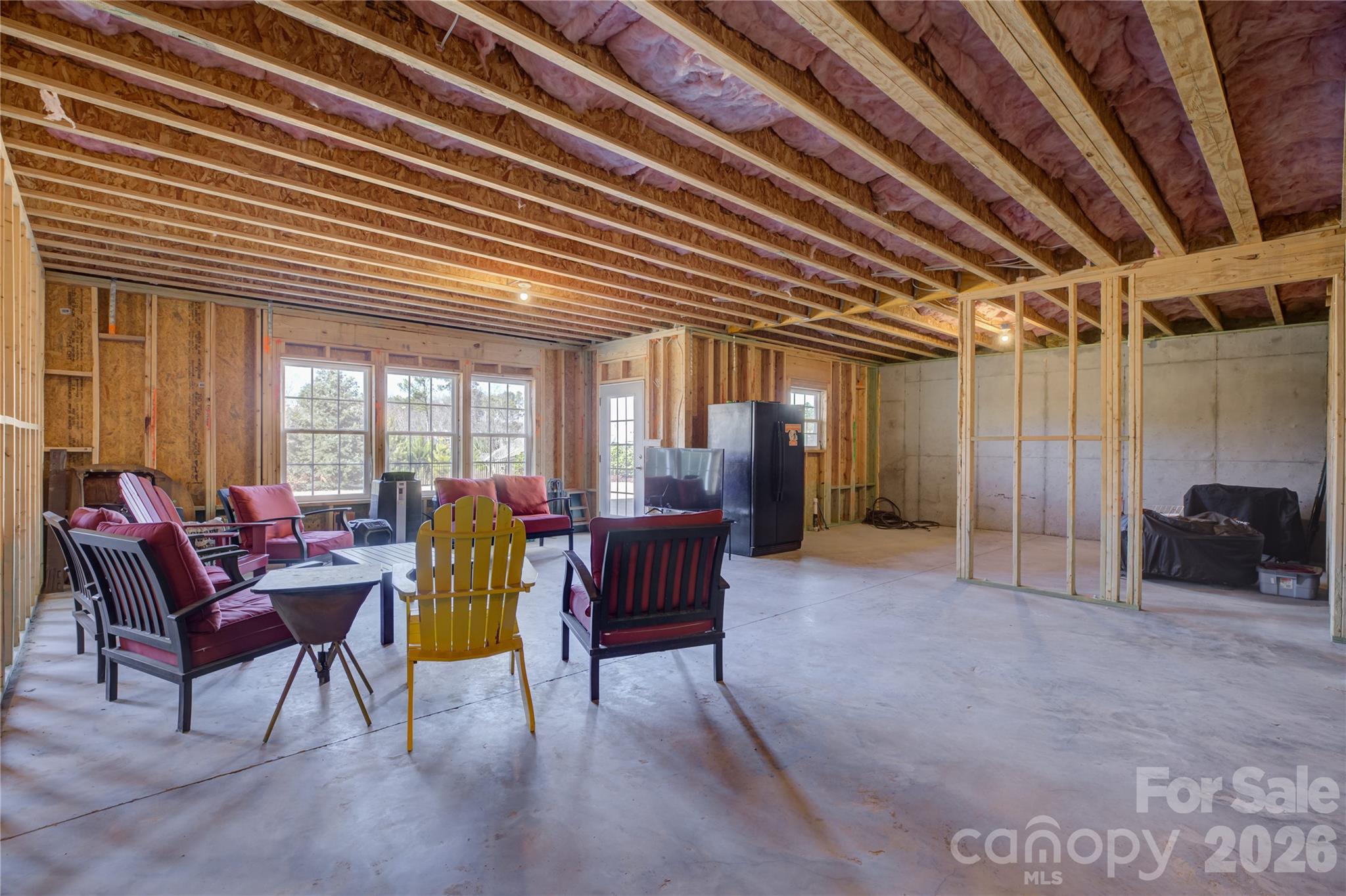 16541 Cozy Cove Road Charlotte, NC 28278 - Photo 38 of 47 a living room with furniture and a chandelier