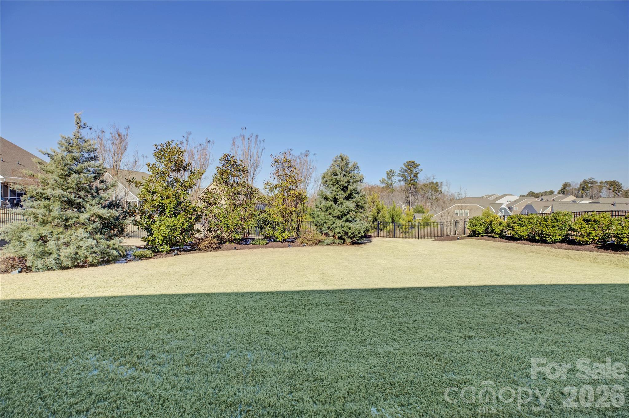 16541 Cozy Cove Road Charlotte, NC 28278 - Photo 41 of 47 a view of a field with an ocean and trees