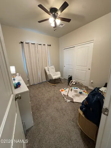 a bed room with a bed and a chandelier