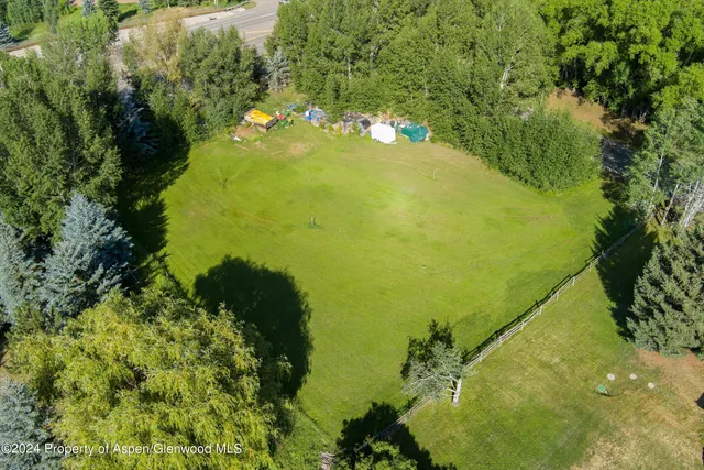 a view of a lake with a yard