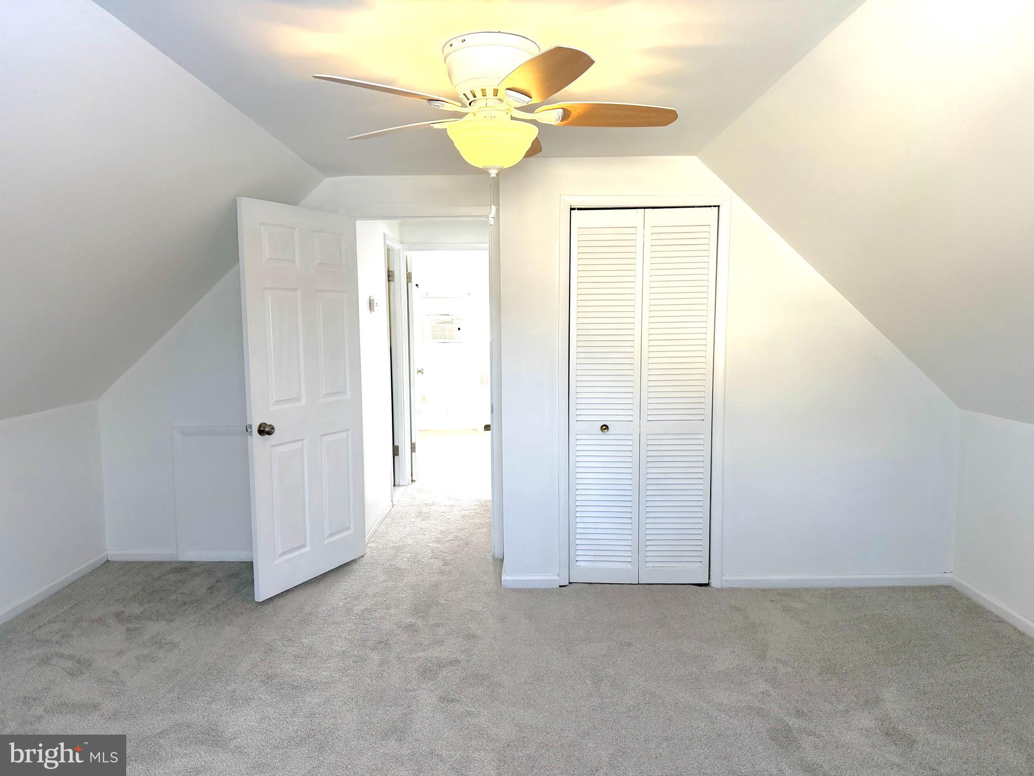 56 Indian Red Road Levittown, PA 19057 - Photo 11 of 19 a view of an empty room with a chandelier fan