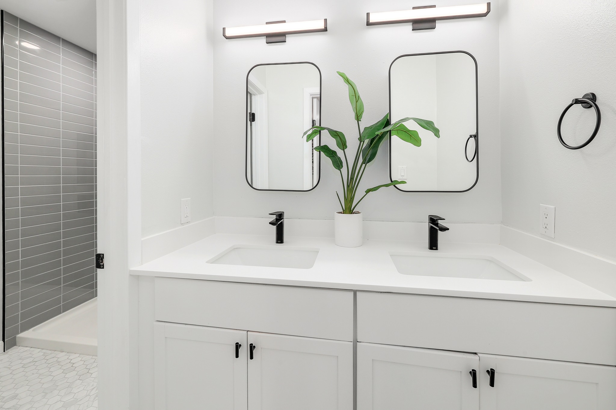 9614 Chukar Circle Austin, TX 78758 - Photo 13 of 26 This primary ensuite bath is beautifully modernized with a gorgeous contemporary vanity and stylish fixtures and hardware.