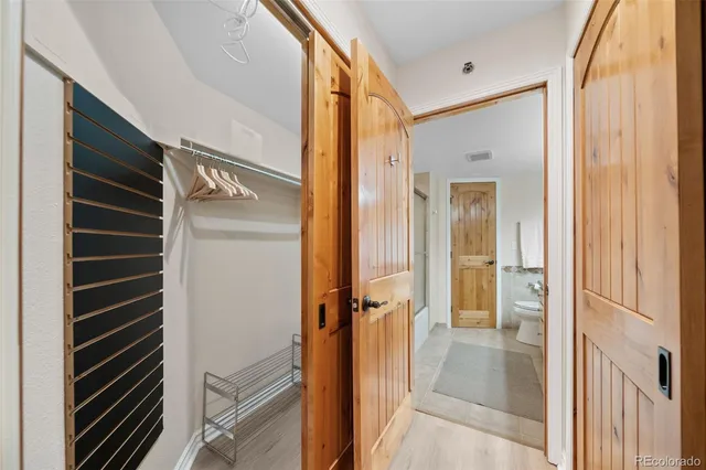 a bathroom with a glass shower door