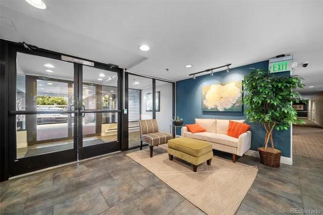 a view of a hallway with wooden floor and entryway