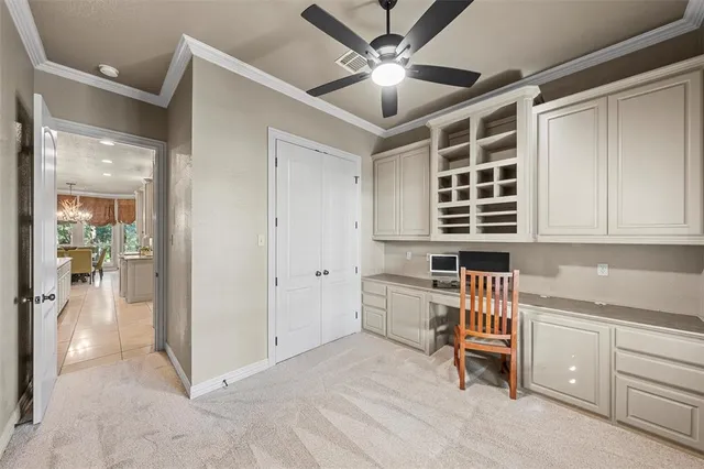 a living room with furniture and a ceiling fan