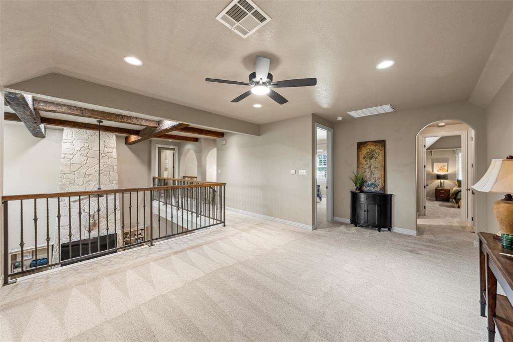 338 Estes Rch Road Bruceville, TX 76630 - Photo 29 of 40 a view of a hallway with a chandelier