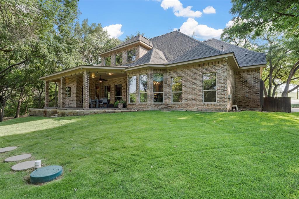 338 Estes Rch Road Bruceville, TX 76630 - Photo 37 of 40 a view of a house with a yard porch and sitting area