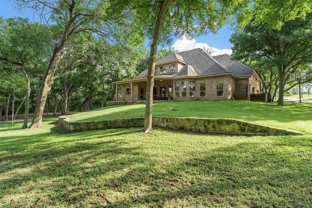 an aerial view of house with yard