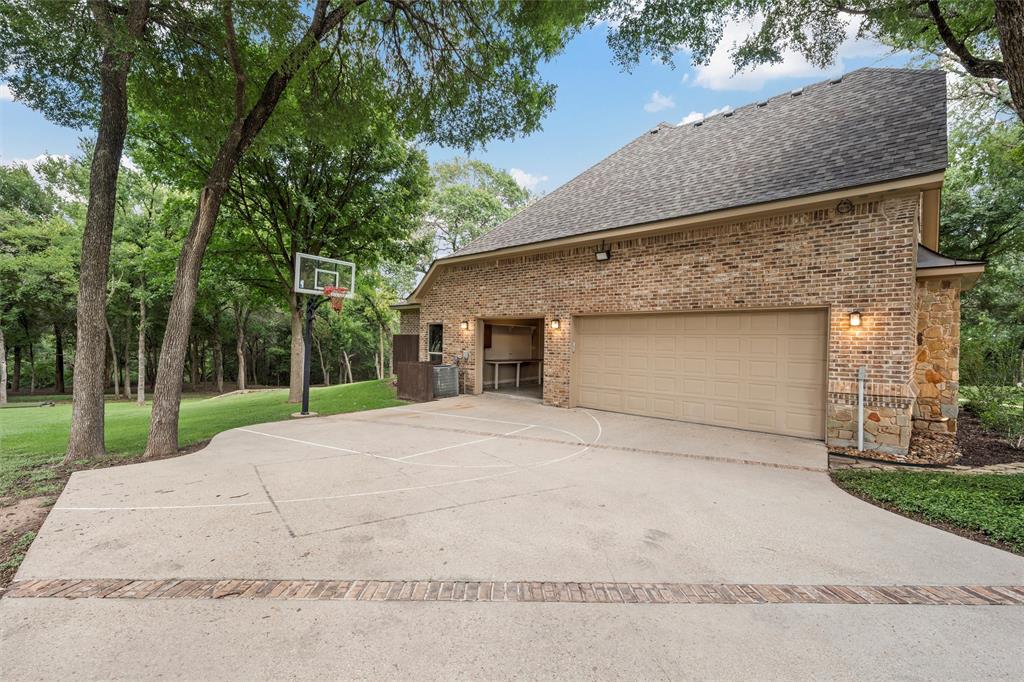 338 Estes Rch Road Bruceville, TX 76630 - Photo 7 of 40 a front view of a house with a yard and garage