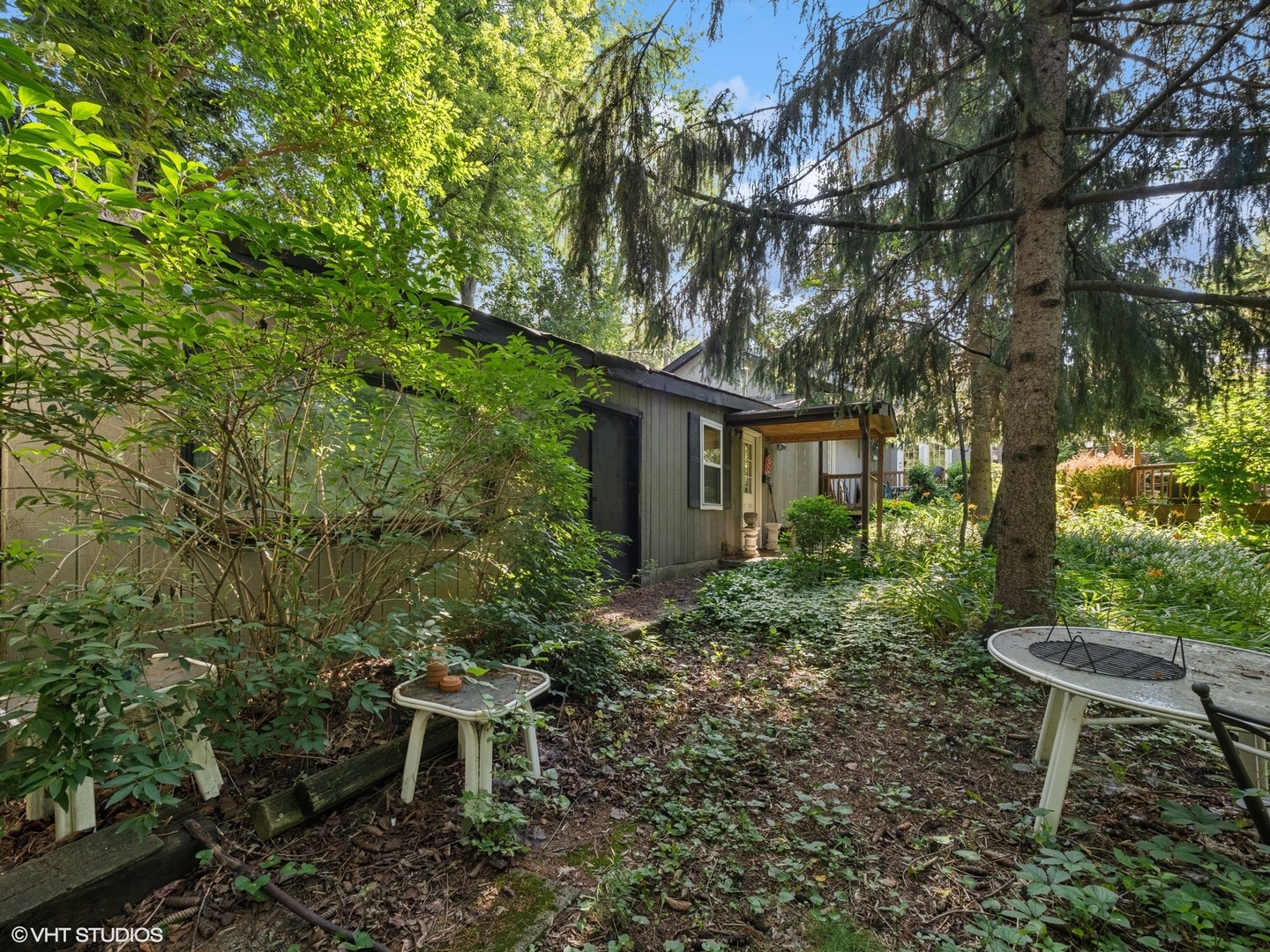 724 South Plum Grove Road Palatine, IL 60067 - Photo 20 of 37 a view of a chair and table in backyard of the house