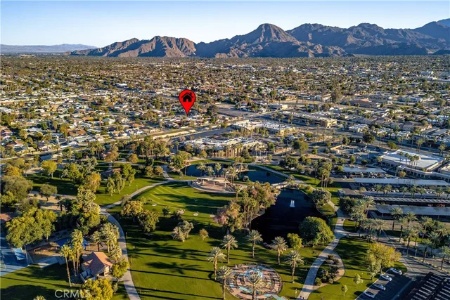an aerial view of residential building with parking space