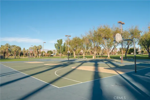 a view of a house with garden and trees