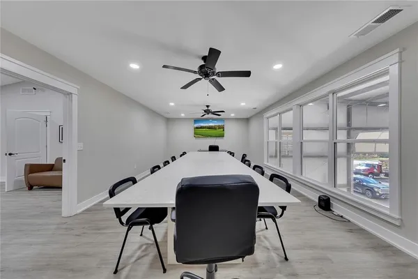 a view of a dining room with furniture window and wooden floor