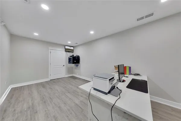 a room with furniture and white walls