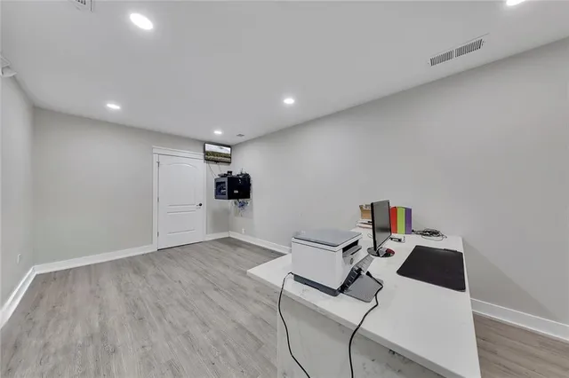 a room with furniture and white walls