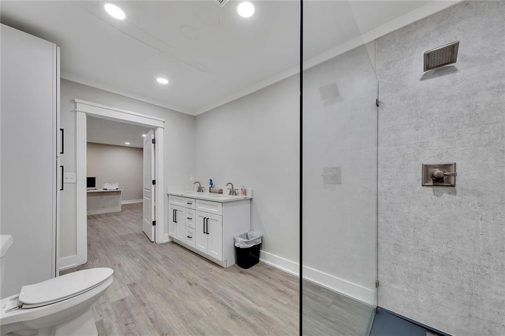 84 Lower Dowda Mill Road Jasper, GA 30143 - Photo 18 of 29 a bathroom with a sink a toilet and shower