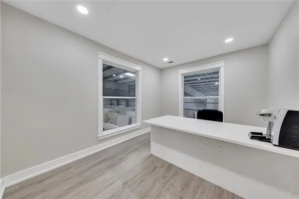 a living room with a furniture and a window