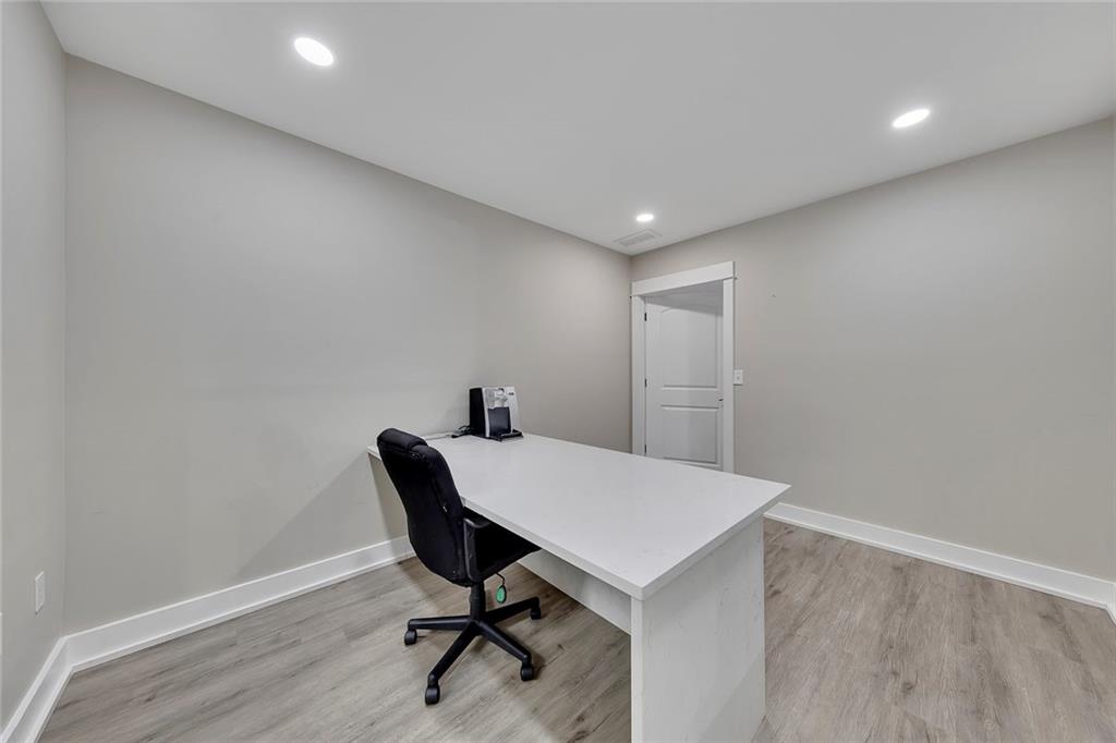 84 Lower Dowda Mill Road Jasper, GA 30143 - Photo 23 of 29 a view of a workspace with furniture and wooden floor