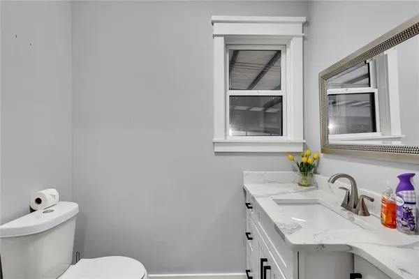 a bathroom with a sink and a toilet