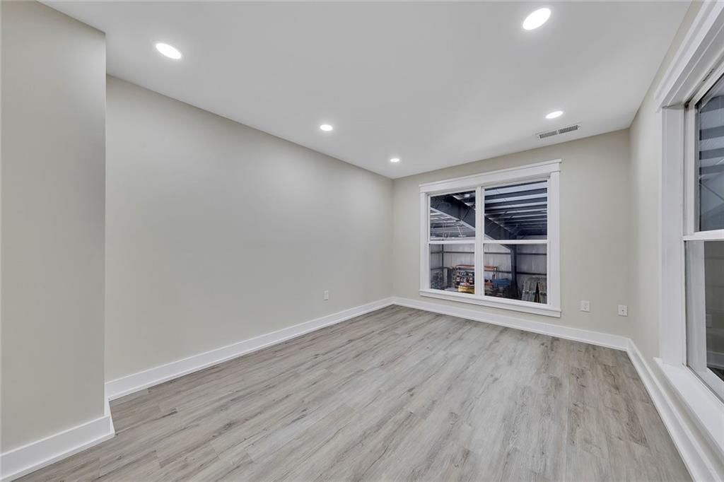 84 Lower Dowda Mill Road Jasper, GA 30143 - Photo 25 of 29 a view of wooden floor and windows in a room