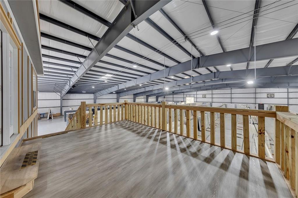 84 Lower Dowda Mill Road Jasper, GA 30143 - Photo 5 of 29 a view of an empty room with wooden floor