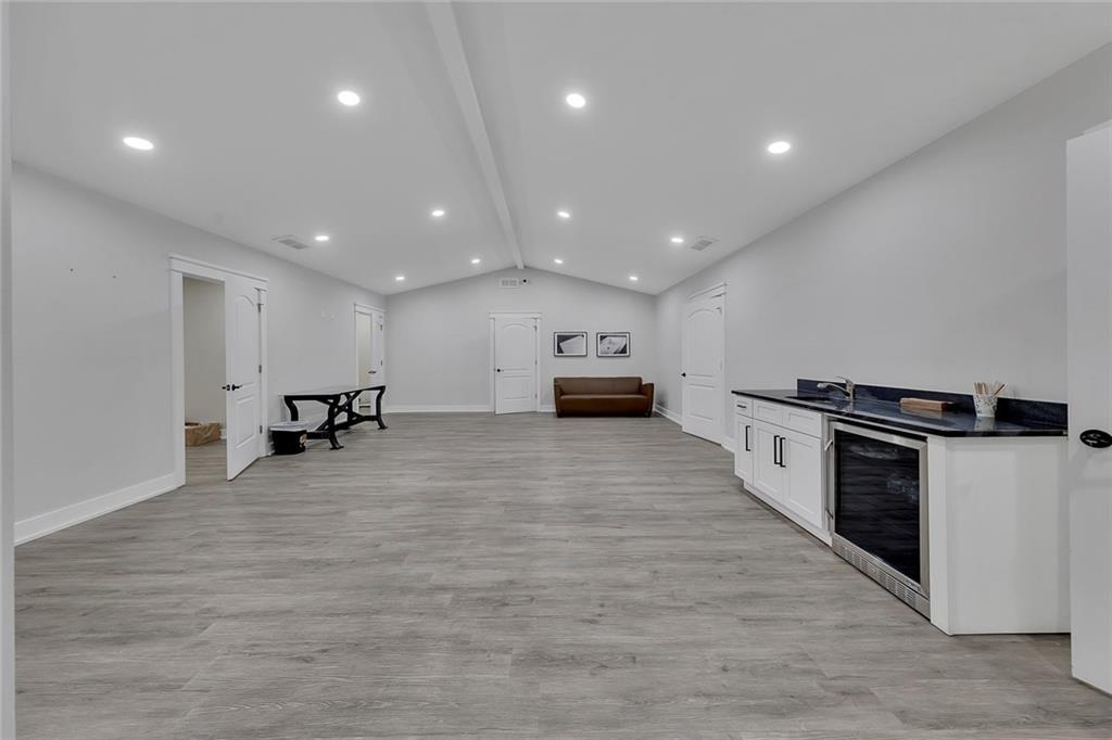 84 Lower Dowda Mill Road Jasper, GA 30143 - Photo 6 of 29 a living room with stainless steel appliances furniture a kitchen view and a wooden floor