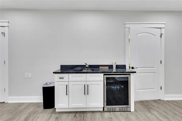 a kitchen with granite countertop a stove and a sink