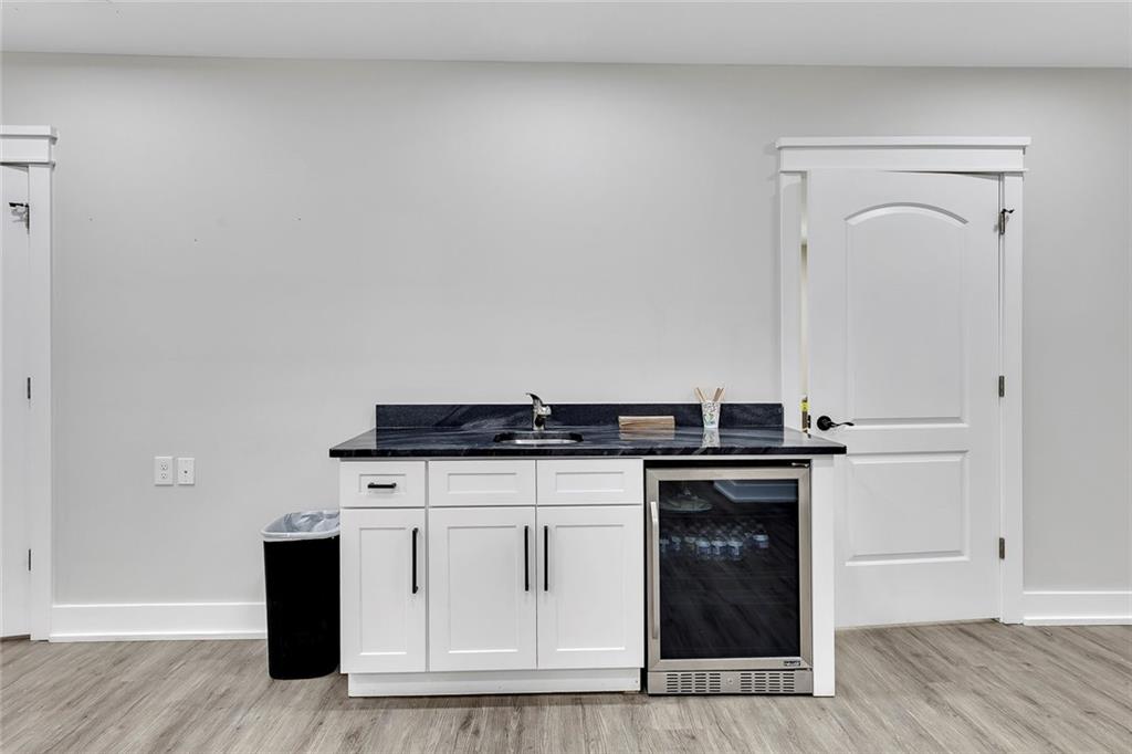 84 Lower Dowda Mill Road Jasper, GA 30143 - Photo 8 of 29 a kitchen with granite countertop a stove and a sink