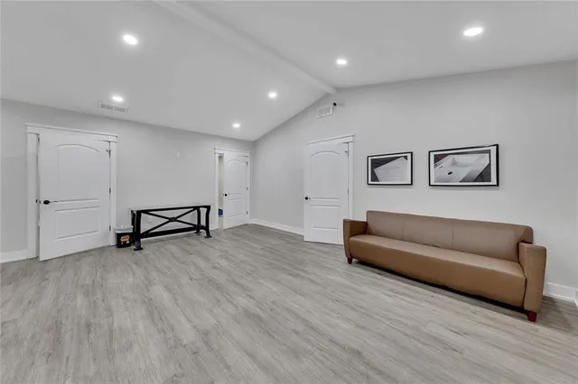 a view of a livingroom with furniture and wooden floor