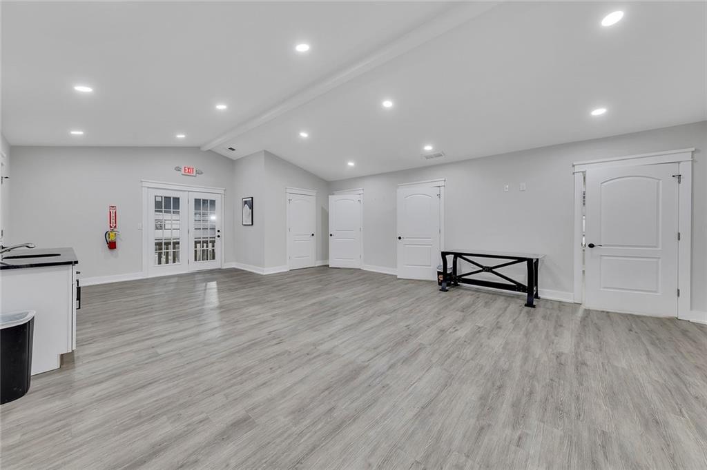 84 Lower Dowda Mill Road Jasper, GA 30143 - Photo 10 of 29 a view of an empty room with wooden floor and a fireplace
