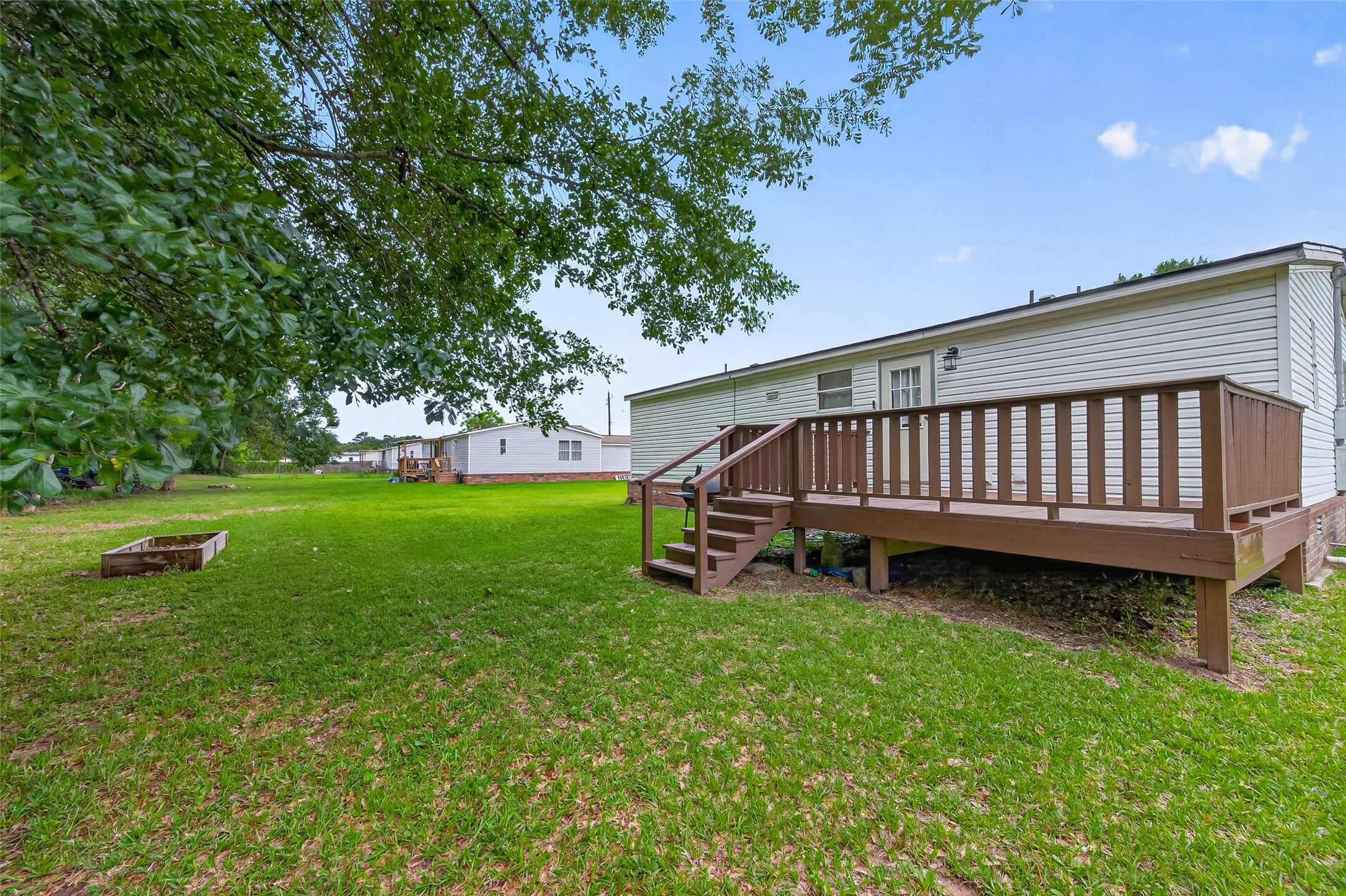 16572 River Ranch Drive Conroe, TX 77302 - Photo 18 of 18 a view of a backyard with a garden